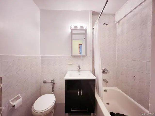 a bathroom with a sink toilet and vanity