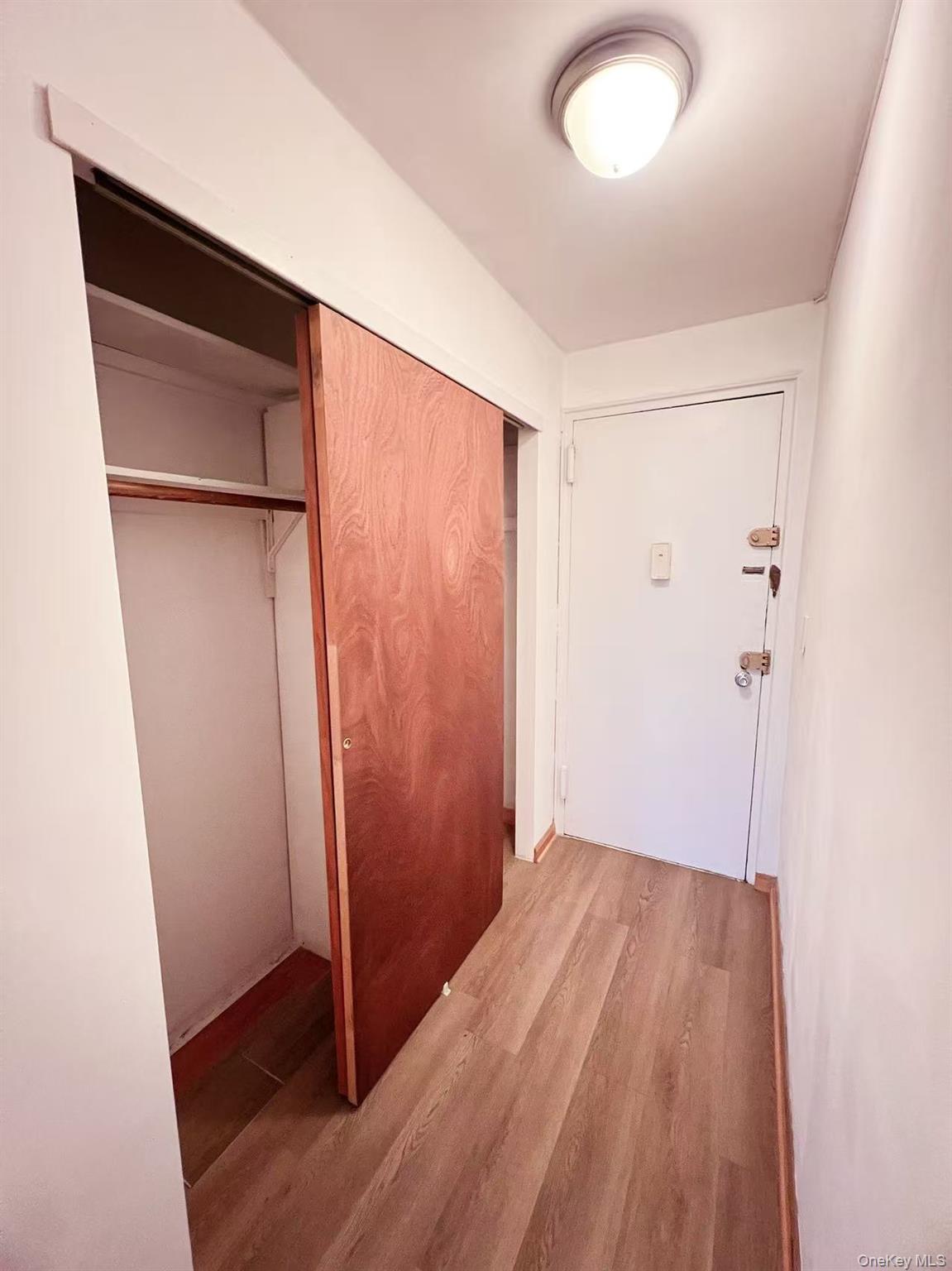 15272 Melbourne Avenue, Unit 3A Queens, NY 11367 - Photo 9 of 13 wooden floor in an empty room
