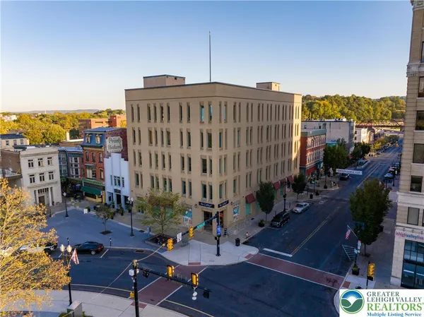 a view of a building with sitting area