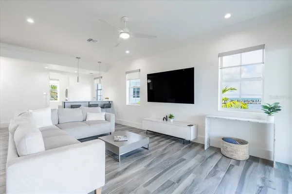 a kitchen with granite countertop white cabinets and stainless steel appliances