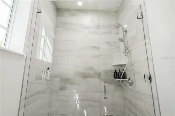 a bathroom with a shower and a shower curtain
