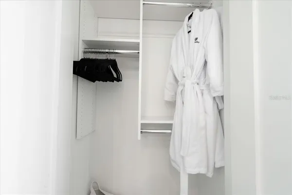 an aerial view of a house with garden space and lake view