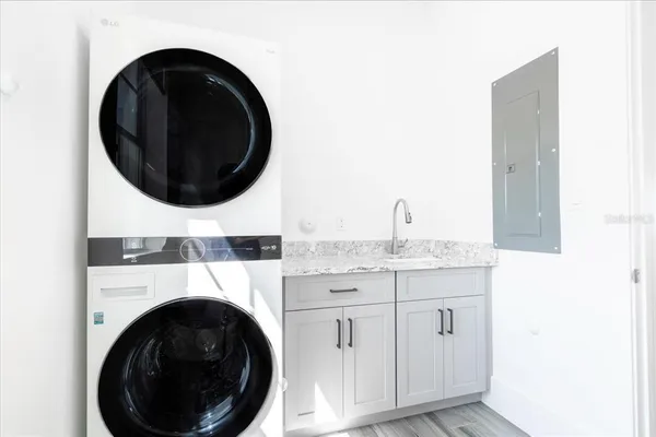 a living room with furniture and kitchen view