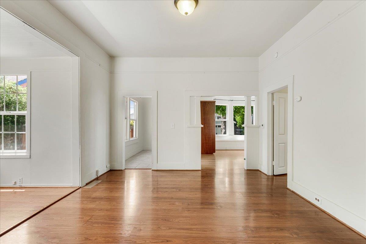 113 Fairbanks Street Santa Cruz, CA 95060 - Photo 11 of 27 a view of an empty room with wooden floor and a window