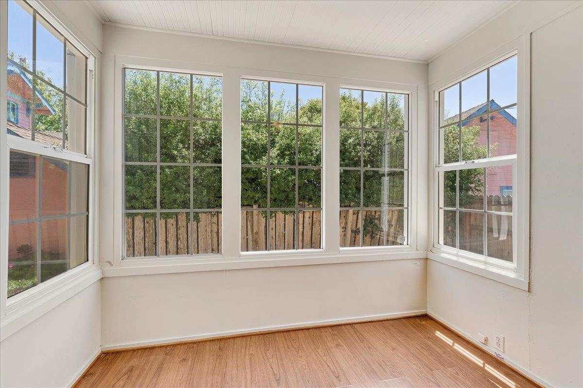 113 Fairbanks Street Santa Cruz, CA 95060 - Photo 14 of 27 a view of an empty room with wooden floor and a window