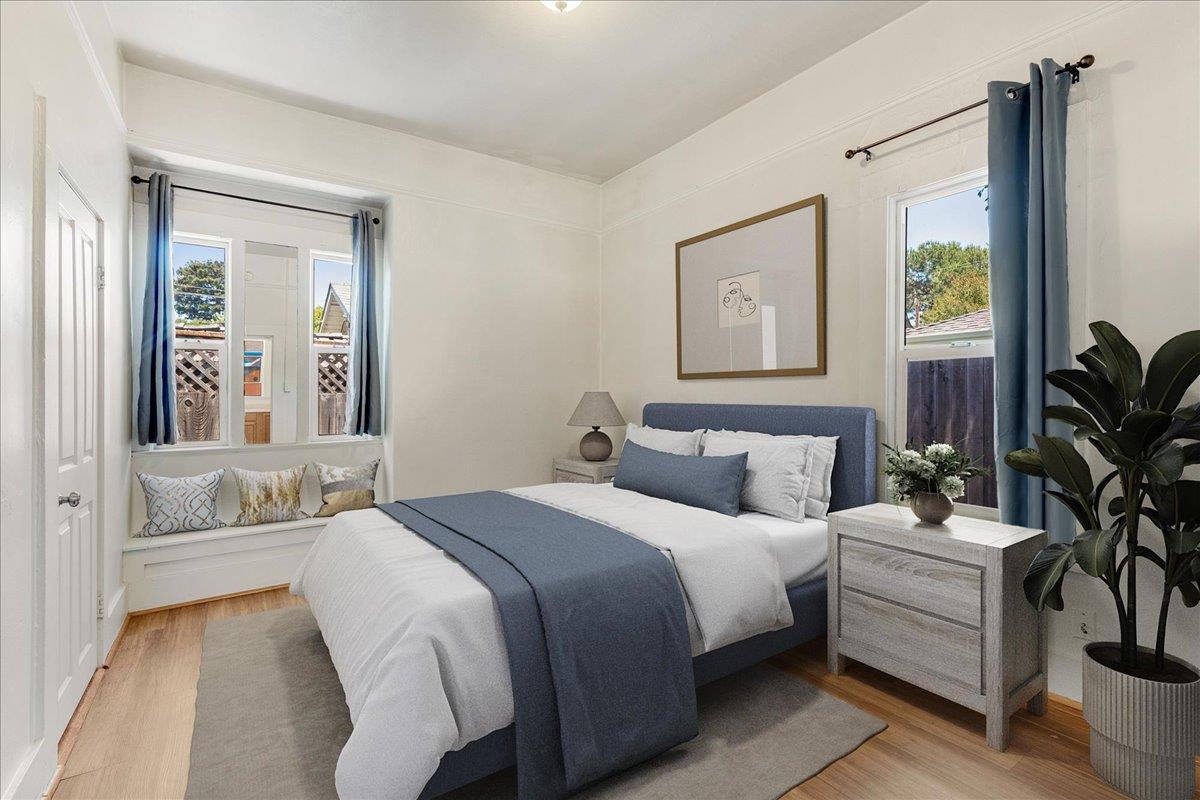 113 Fairbanks Street Santa Cruz, CA 95060 - Photo 17 of 27 a bedroom with a bed and a large mirror