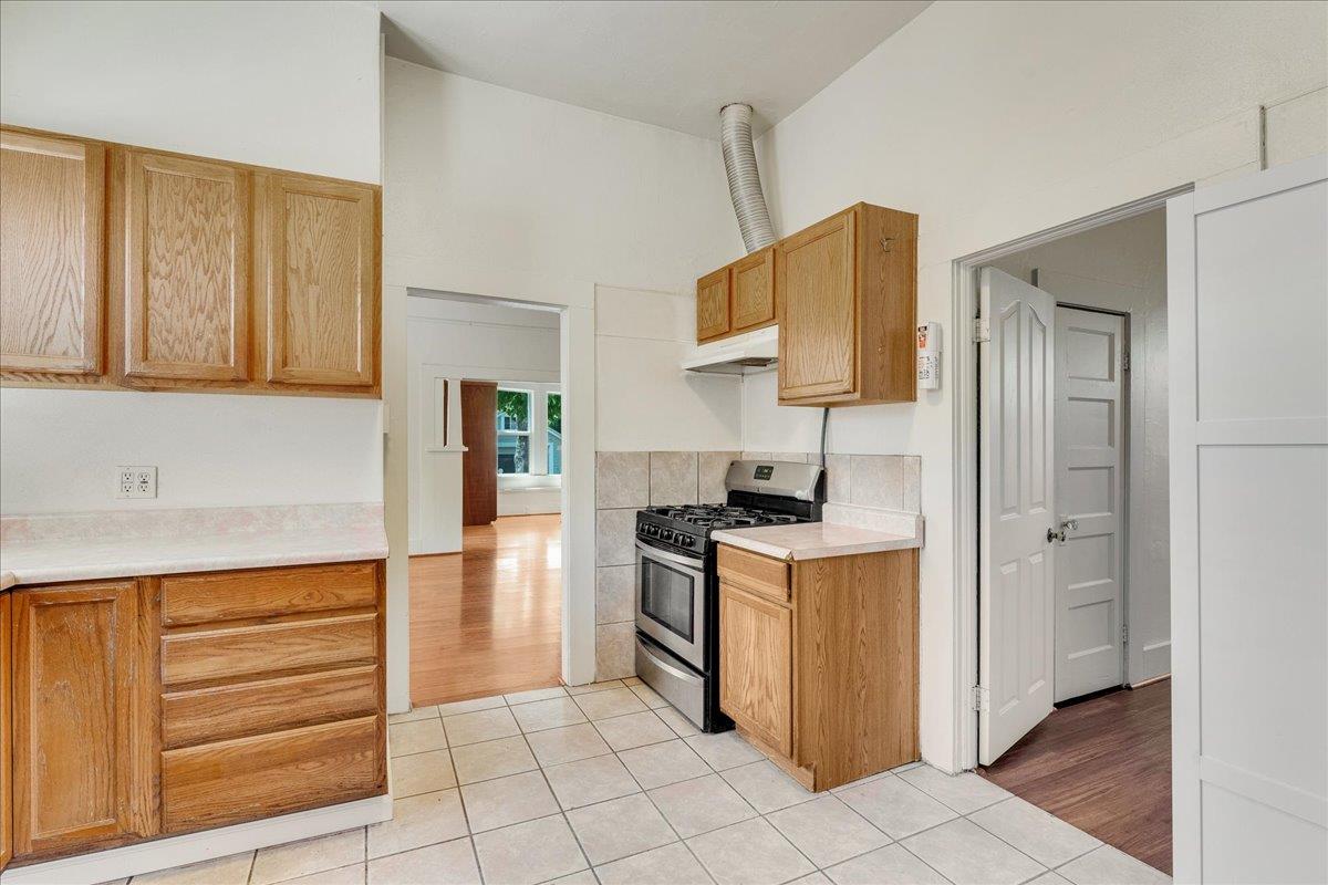 113 Fairbanks Street Santa Cruz, CA 95060 - Photo 22 of 27 a kitchen with a stove and a refrigerator