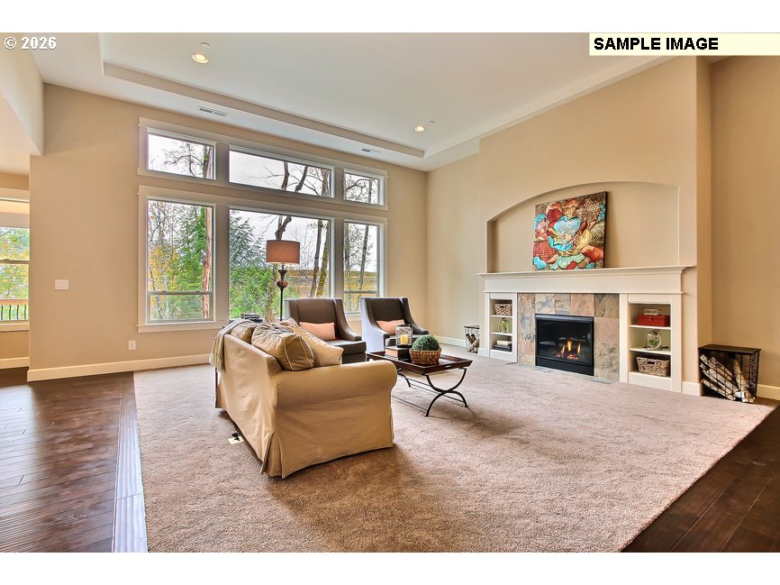 16997 Southwest Parrett Mountain Road Sherwood, OR 97140 - Photo 8 of 15 a living room with furniture large window and a fireplace