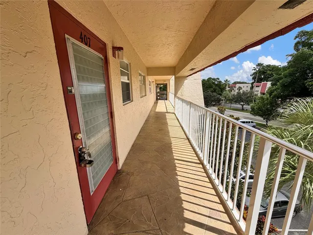 a view of balcony with wooden floor and stairs