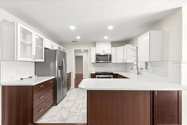 a bathroom with a granite countertop sink a toilet and a mirror