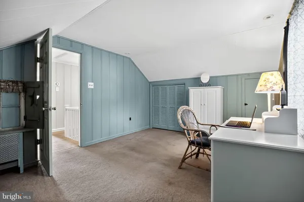 a workspace with furniture and a lamp