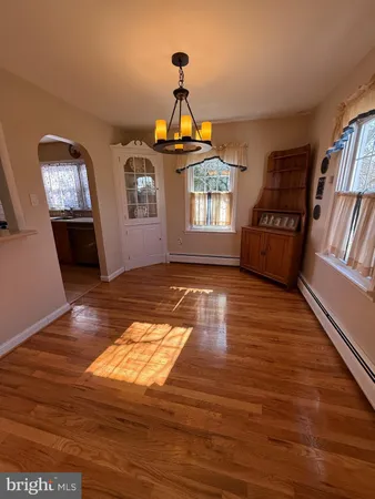 a view of livingroom with hardwood floor and hallway