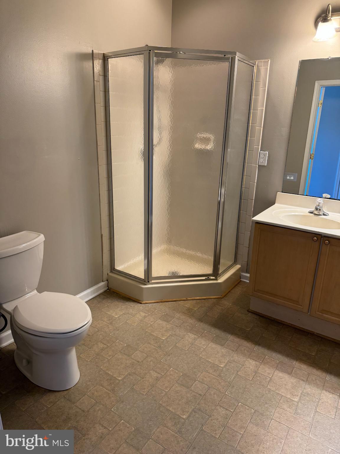 39 Sagewood Street Charles Town, WV 25414 - Photo 13 of 19 a bathroom with a granite countertop sink toilet and shower
