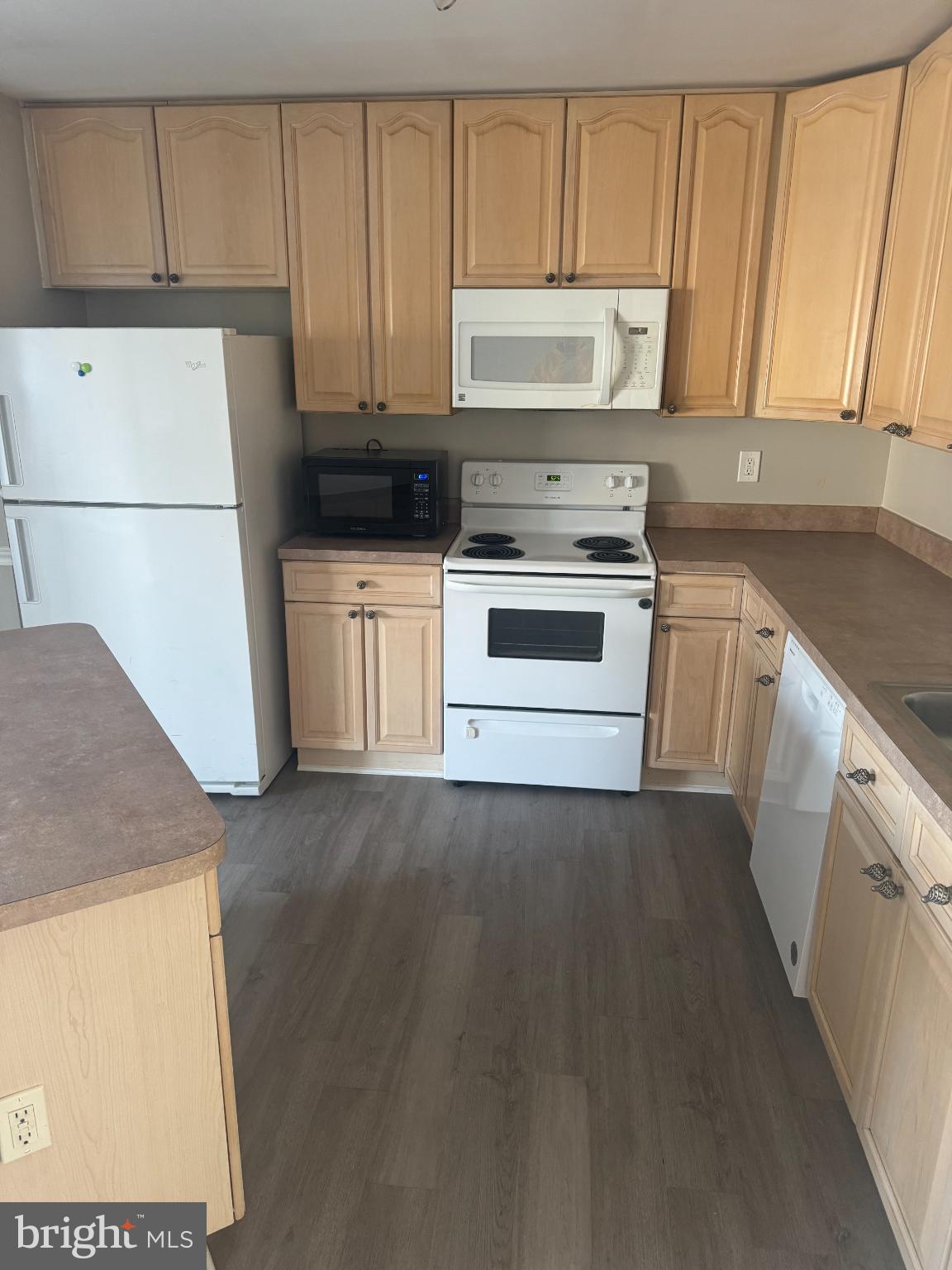 39 Sagewood Street Charles Town, WV 25414 - Photo 6 of 19 a kitchen with a stove a sink and a refrigerator