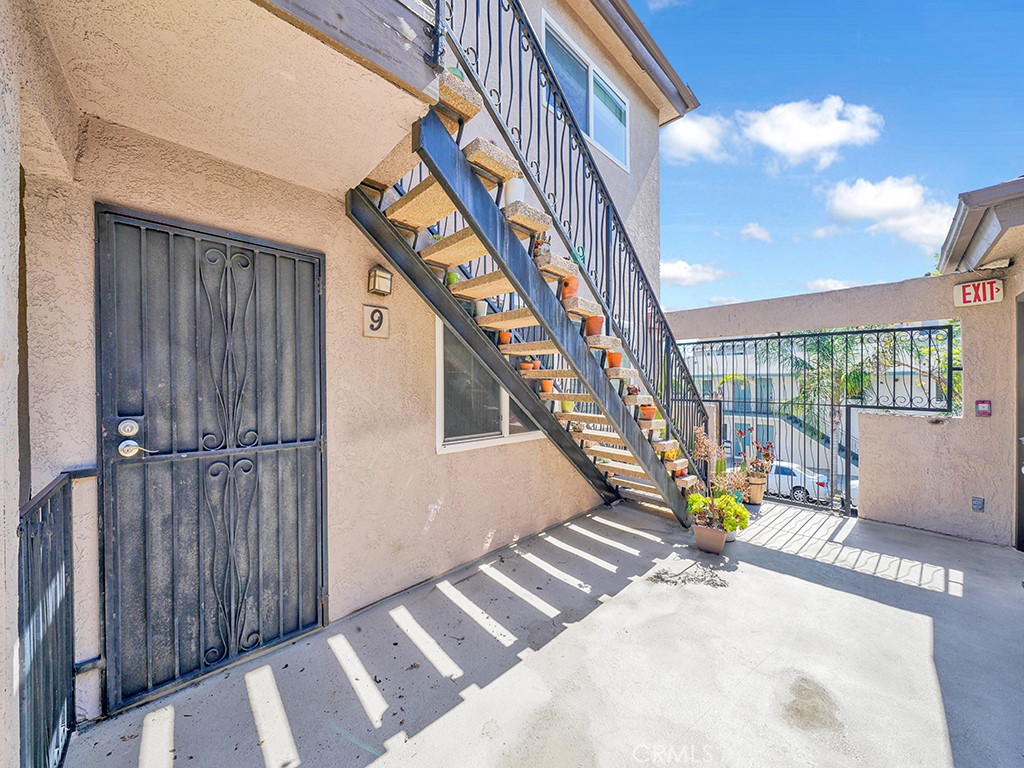 a view of staircase with a rug