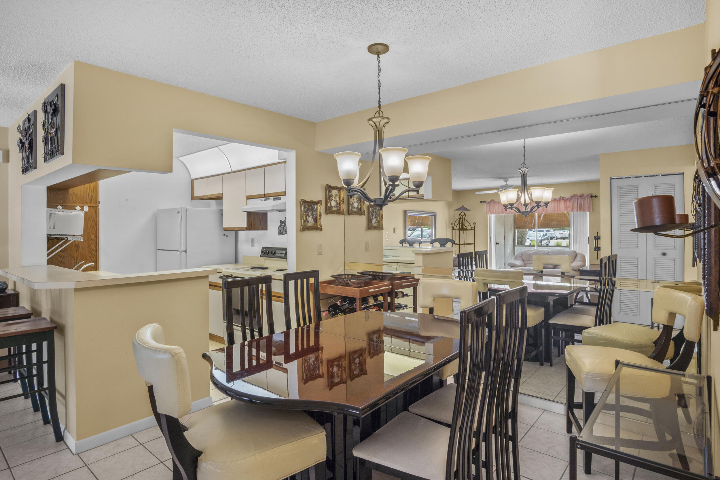2512 Southeast Anchorage Cove, Unit B1 Port St. Lucie, FL 34952 - Photo 14 of 35 a view of a dining room with furniture window and outside view
