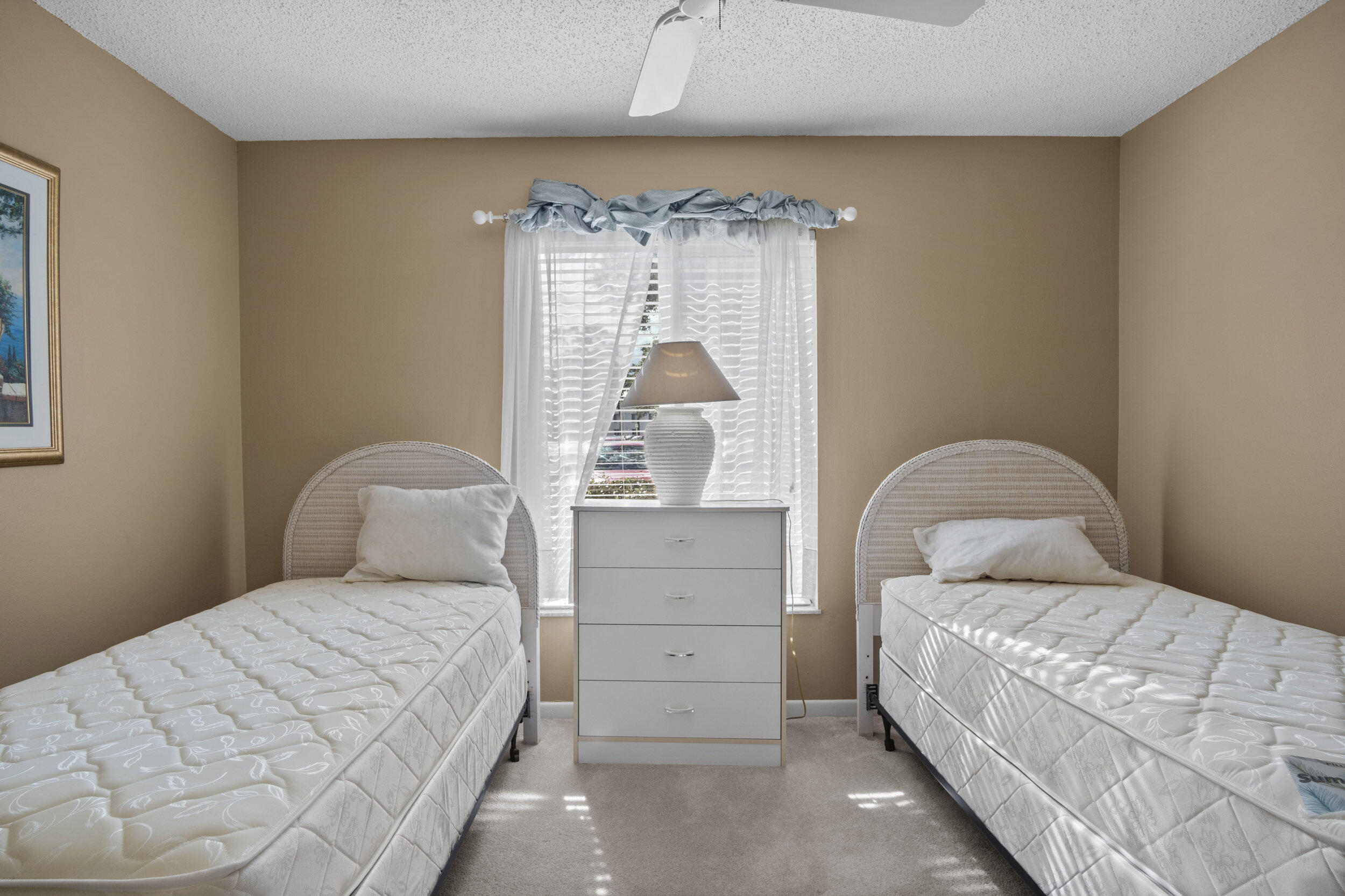 2512 Southeast Anchorage Cove, Unit B1 Port St. Lucie, FL 34952 - Photo 20 of 35 a bedroom with a bed and a window