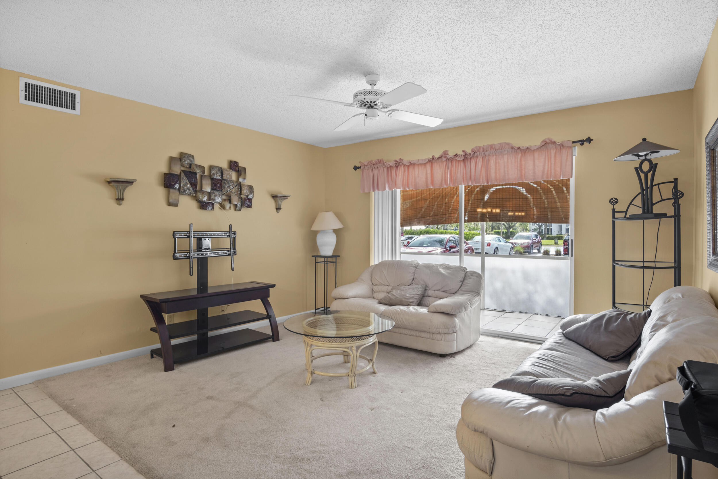2512 Southeast Anchorage Cove, Unit B1 Port St. Lucie, FL 34952 - Photo 2 of 35 a living room with furniture and a large window