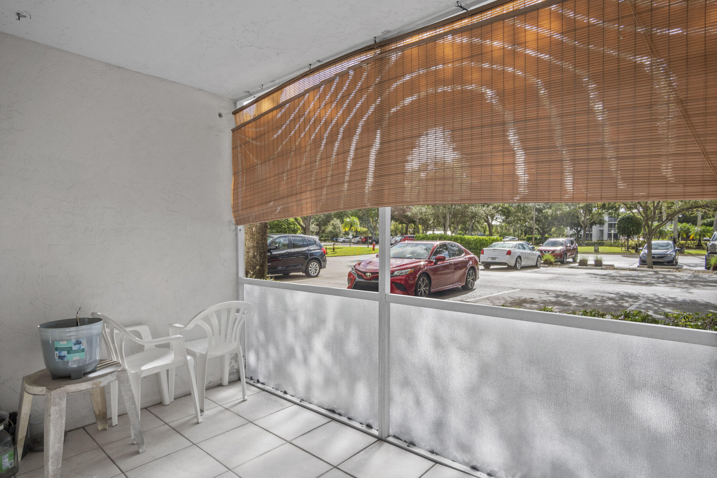 2512 Southeast Anchorage Cove, Unit B1 Port St. Lucie, FL 34952 - Photo 22 of 35 a building with trees in front of it