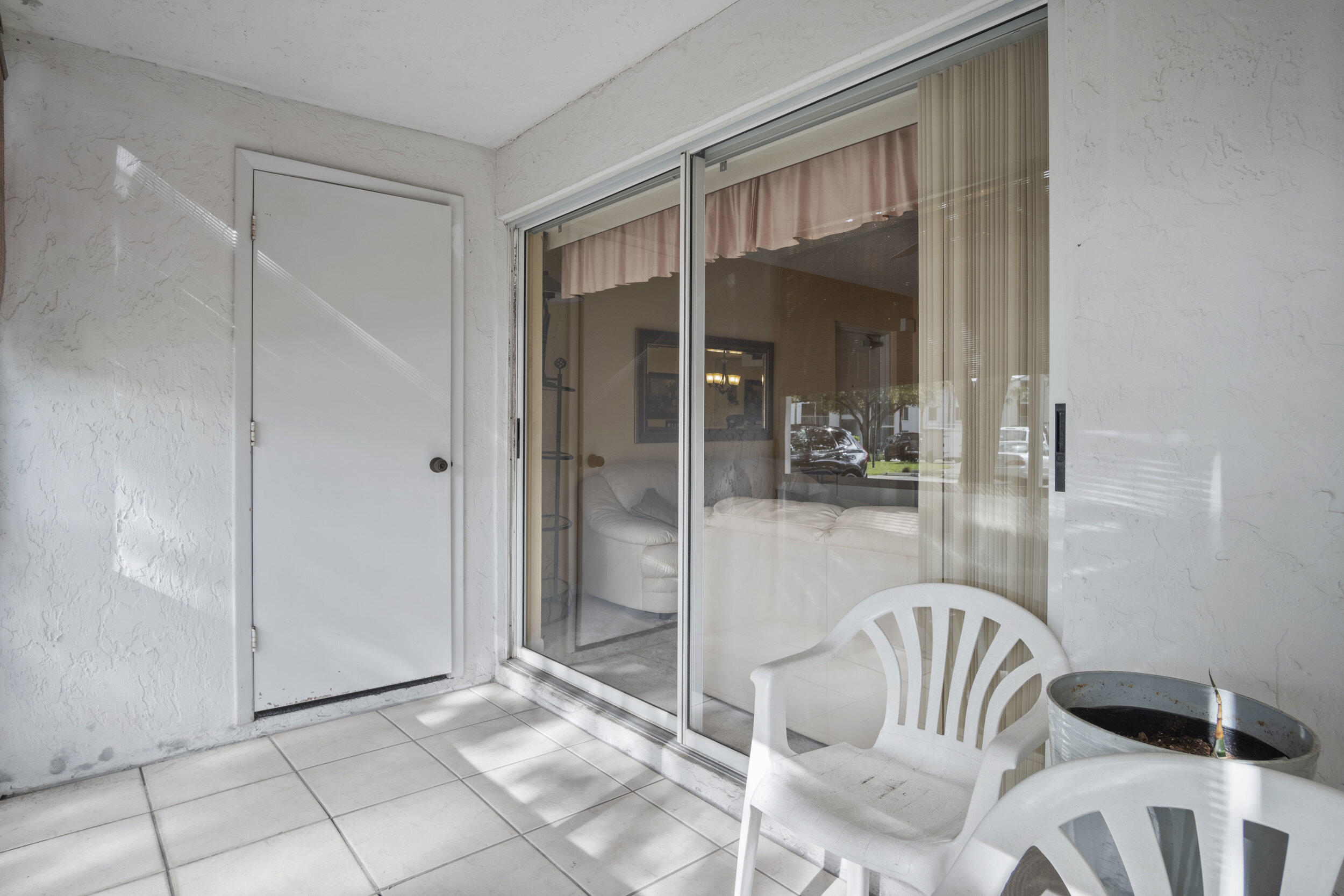 2512 Southeast Anchorage Cove, Unit B1 Port St. Lucie, FL 34952 - Photo 23 of 35 a view of a room that has a glass door and a glass door