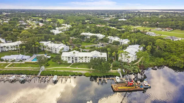 an aerial view of a house with a yard basket ball court and outdoor seating
