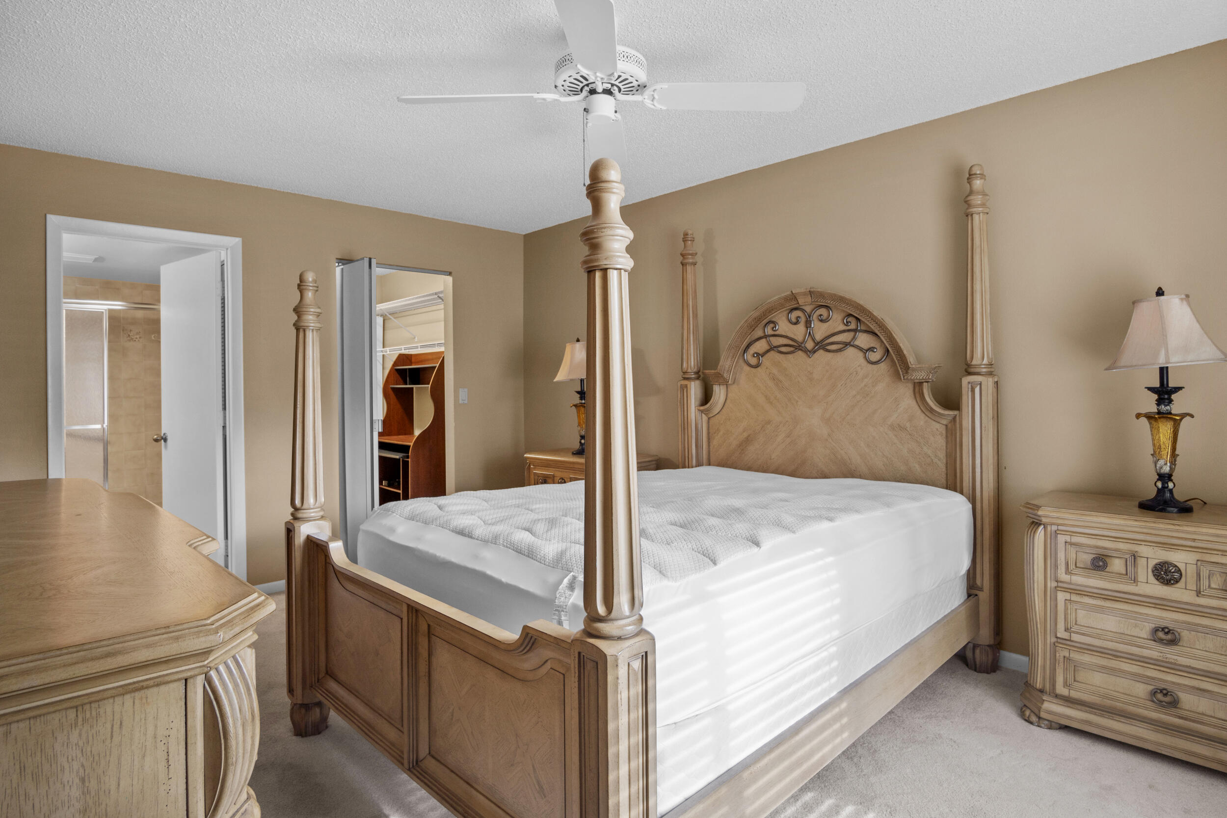 2512 Southeast Anchorage Cove, Unit B1 Port St. Lucie, FL 34952 - Photo 3 of 35 a bedroom with a bed and a dresser