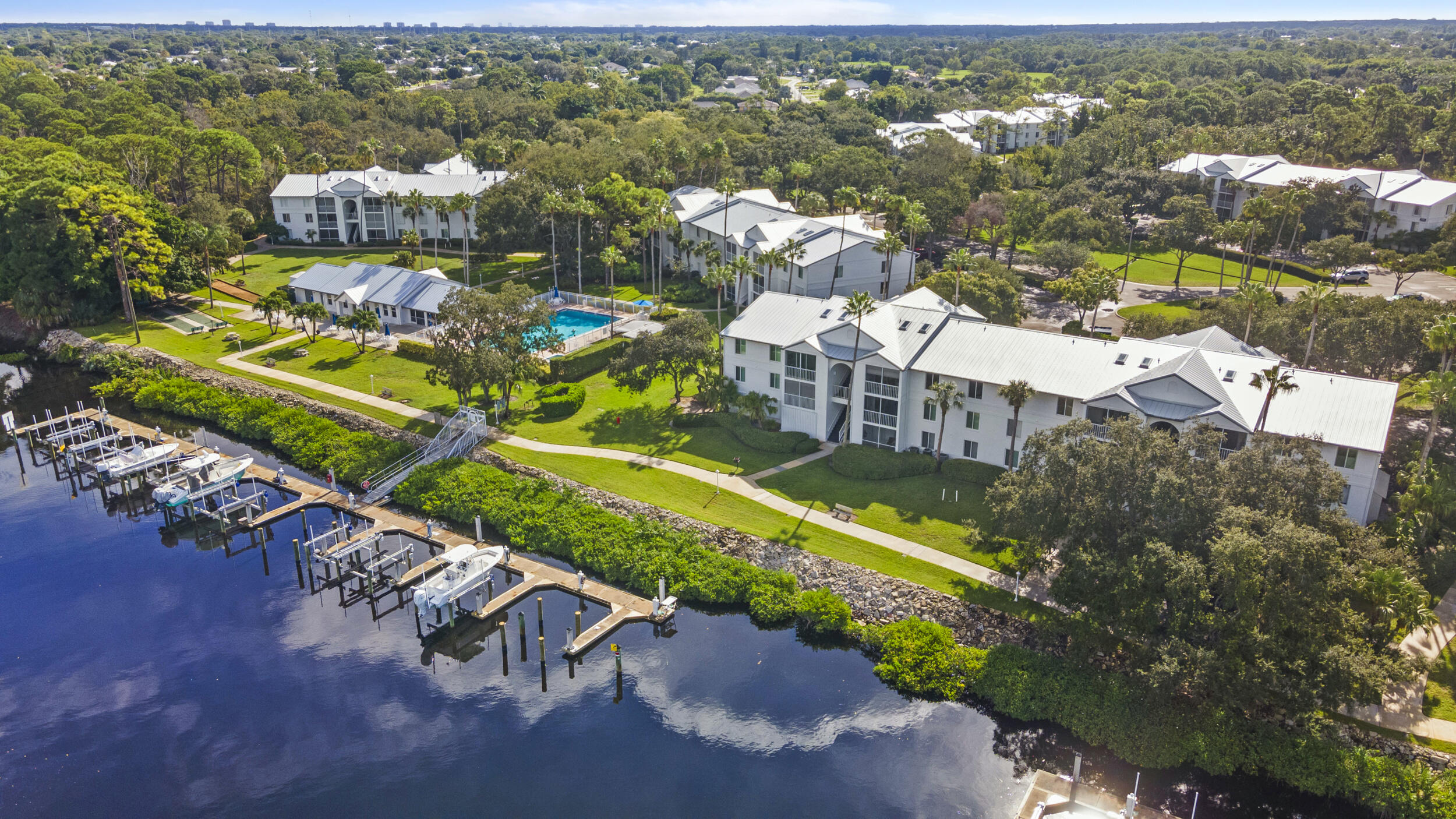 2512 Southeast Anchorage Cove, Unit B1 Port St. Lucie, FL 34952 - Photo 33 of 35 an aerial view of residential houses with outdoor space