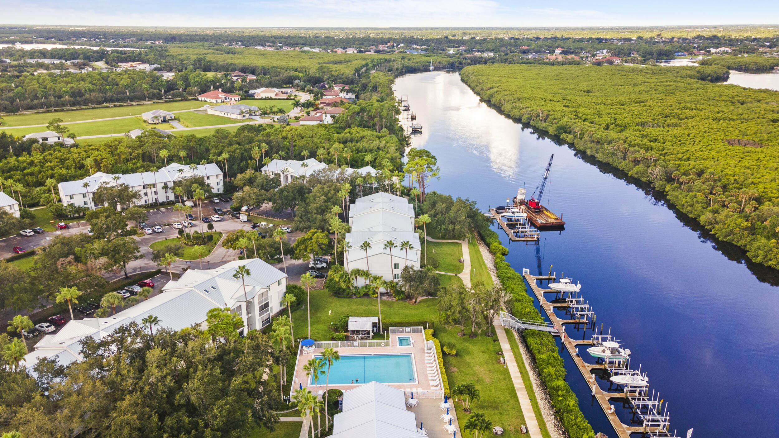2512 Southeast Anchorage Cove, Unit B1 Port St. Lucie, FL 34952 - Photo 4 of 35 an aerial view of ocean and residential houses with outdoor space
