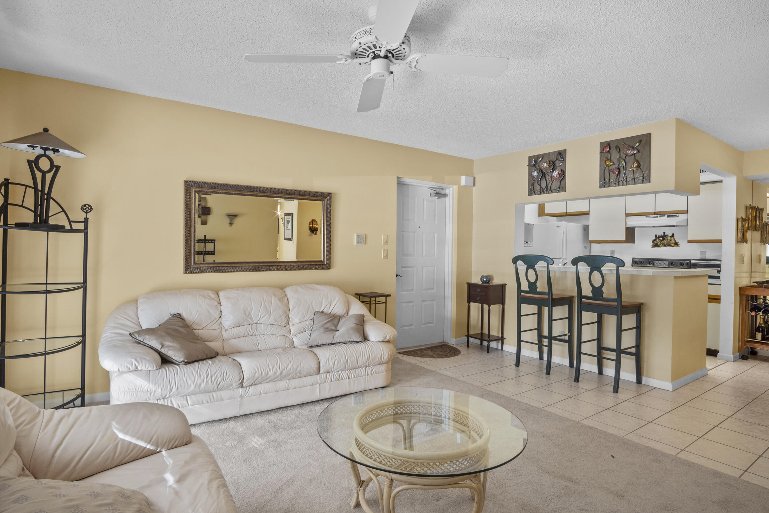 2512 Southeast Anchorage Cove, Unit B1 Port St. Lucie, FL 34952 - Photo 6 of 35 a living room with furniture and a dining table