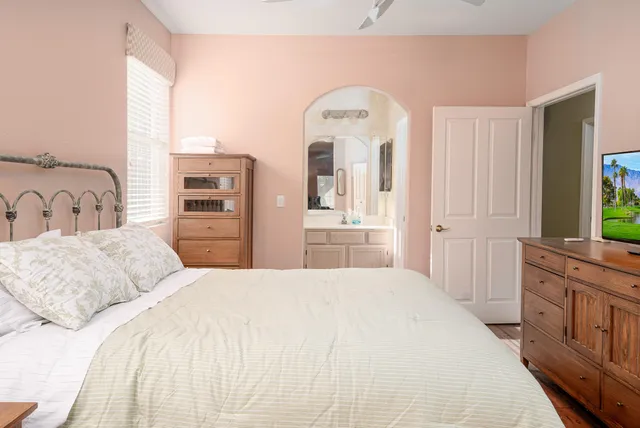 a bedroom with a bed and a dresser