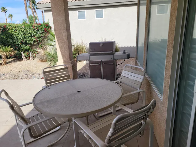 a view of a room with furniture and wooden floor
