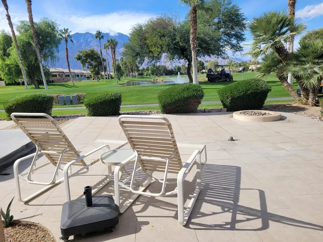 a view of a patio with a yard