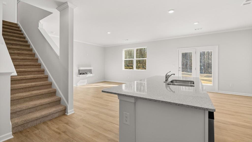 247 Hampton Terrace Dallas, GA 30157 - Photo 6 of 29 a dining room with wooden floor and white walls