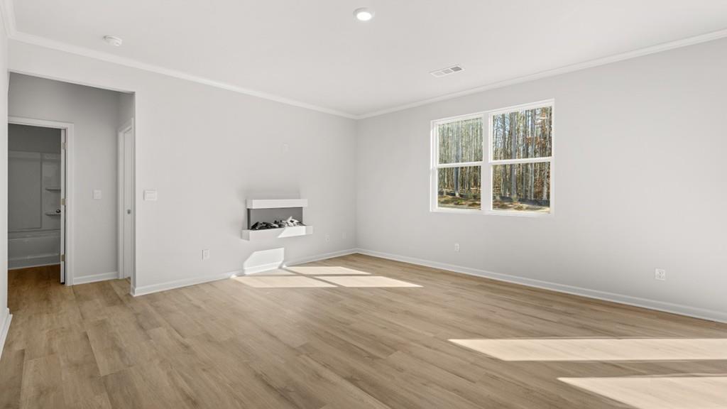 247 Hampton Terrace Dallas, GA 30157 - Photo 7 of 29 a view of an empty room with wooden floor and a window
