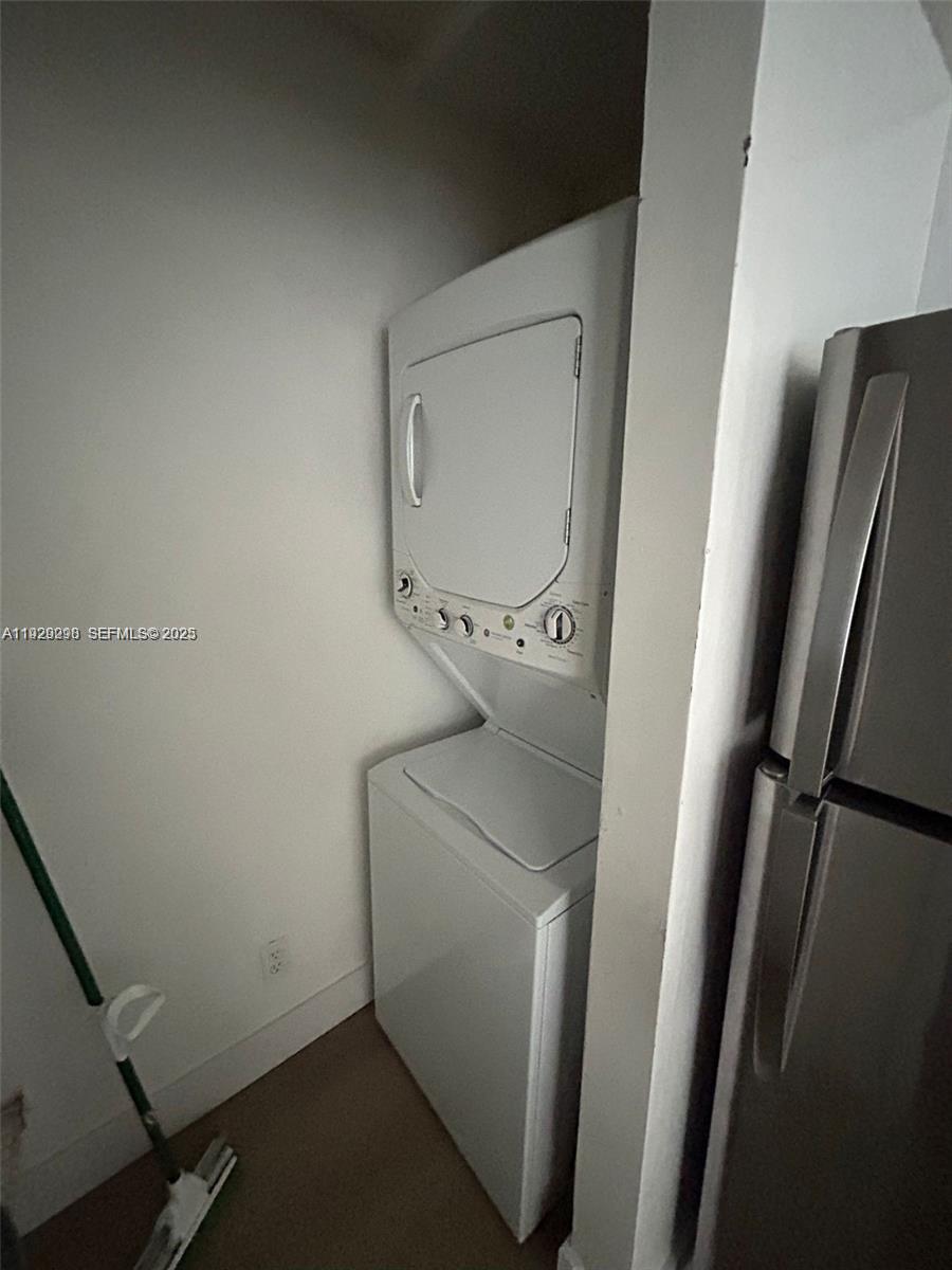 770 Claughton Island Drive, Unit 2109 Miami, FL 33131 - Photo 5 of 9 a bathroom with a sink and toilet