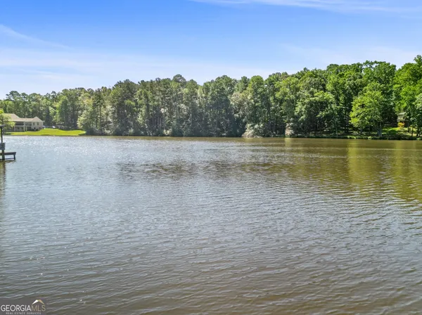 a living room filled with furniture and a large window