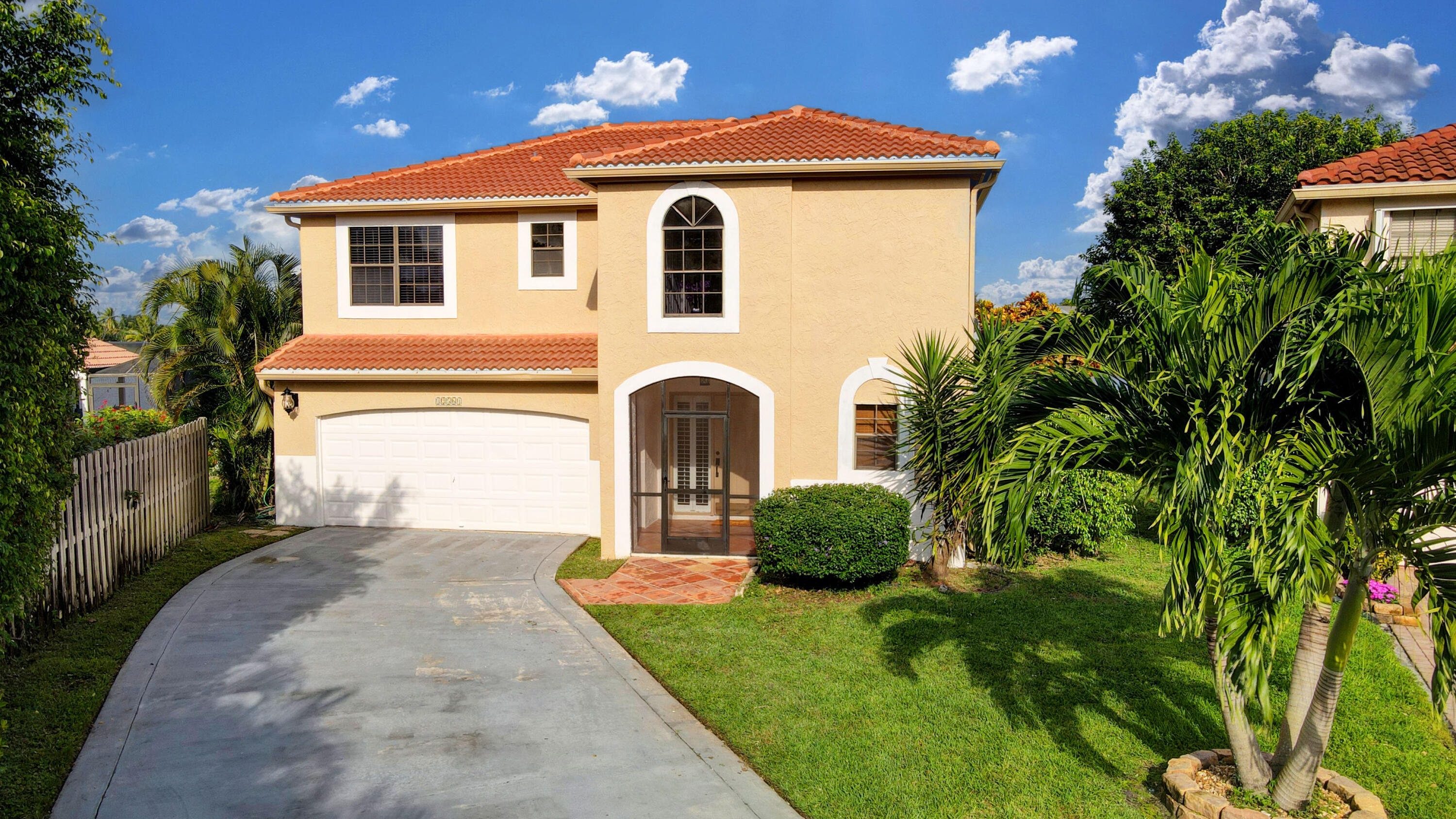 12561 Shoreside Lane Wellington, FL 33414 - Photo 12 of 31 a front view of a house with a yard