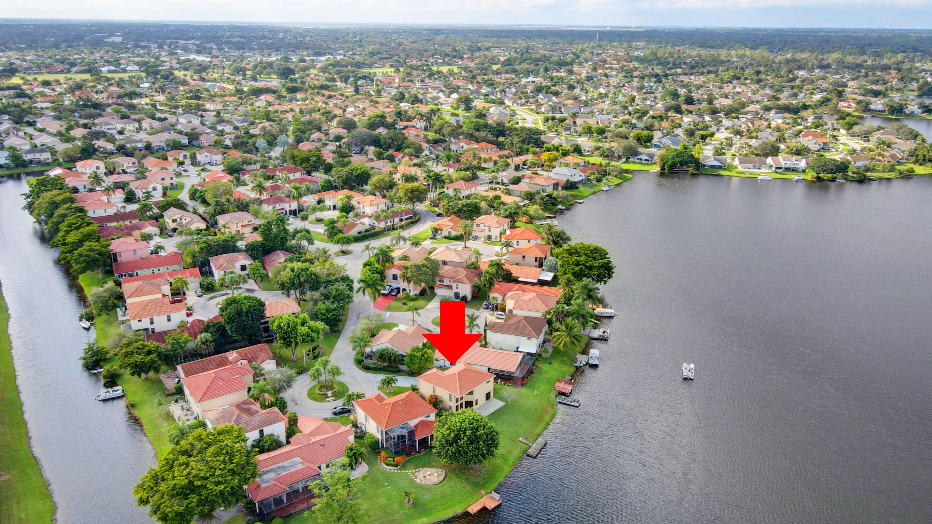 12561 Shoreside Lane Wellington, FL 33414 - Photo 31 of 31 an aerial view of residential houses with outdoor space and trees