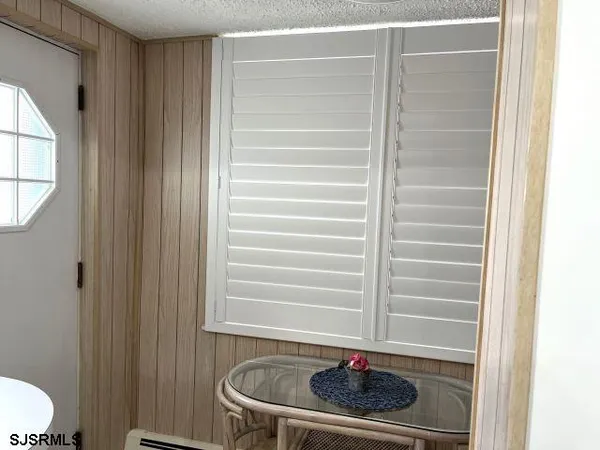 a view of a white building among the street