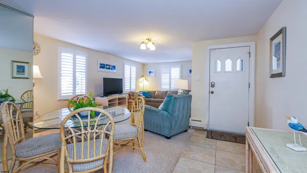 a bedroom with a bed and a lamp