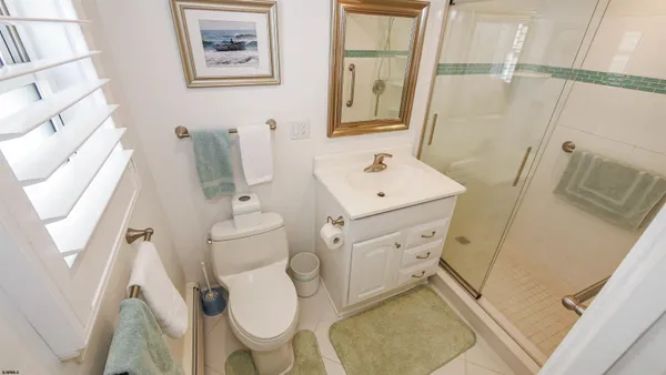 a bedroom with a bed and a lamp