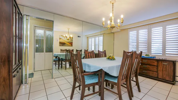 a view of a dining room with furniture and window
