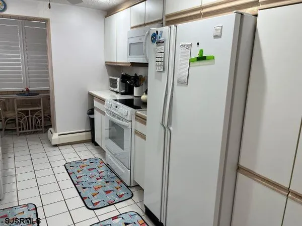 a bedroom with a bed and a television