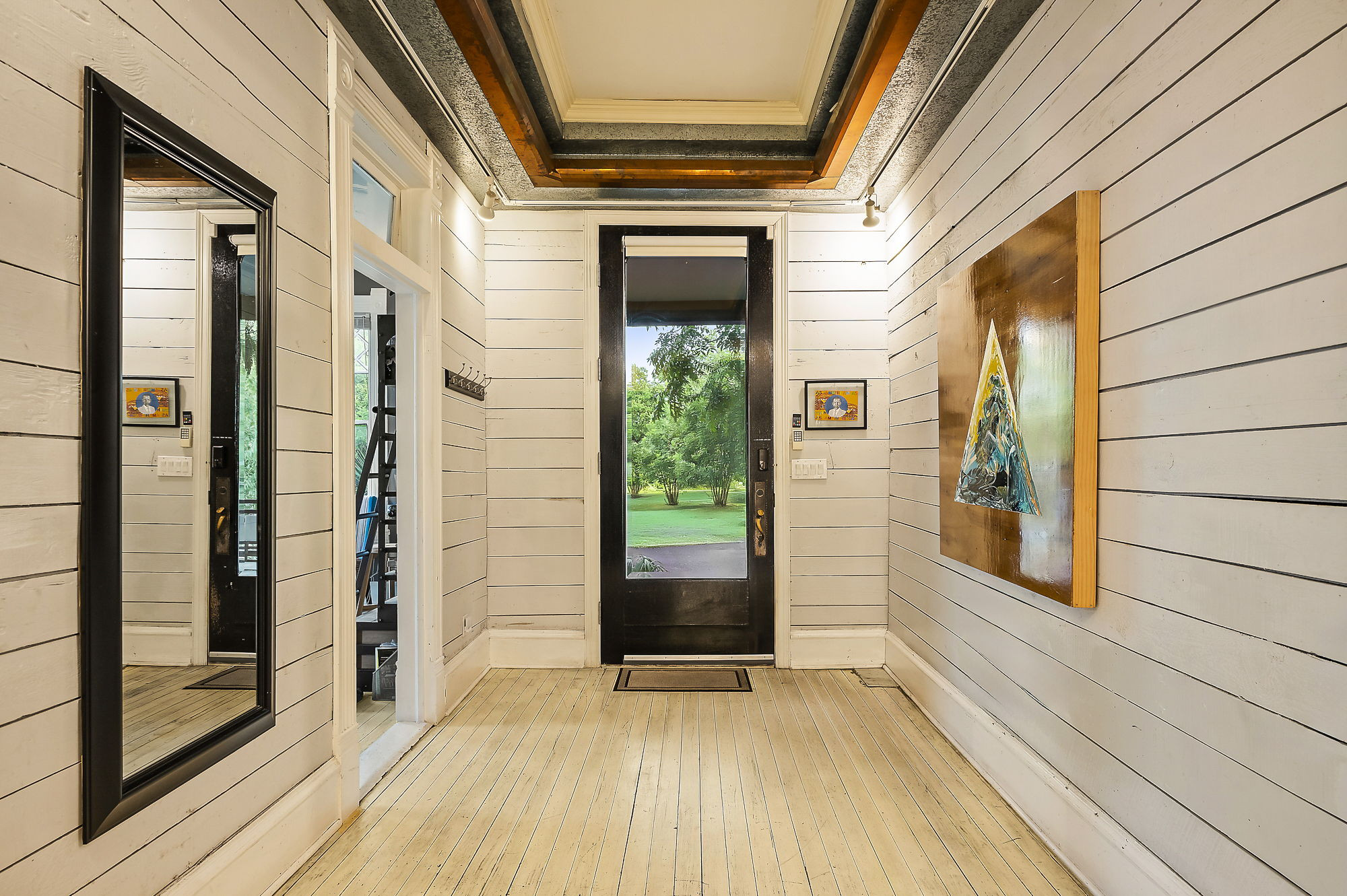 1007 East 8th Street Austin, TX 78702 - Photo 2 of 40 Doorway to outside featuring wooden walls, ornamental molding, and wood-type flooring