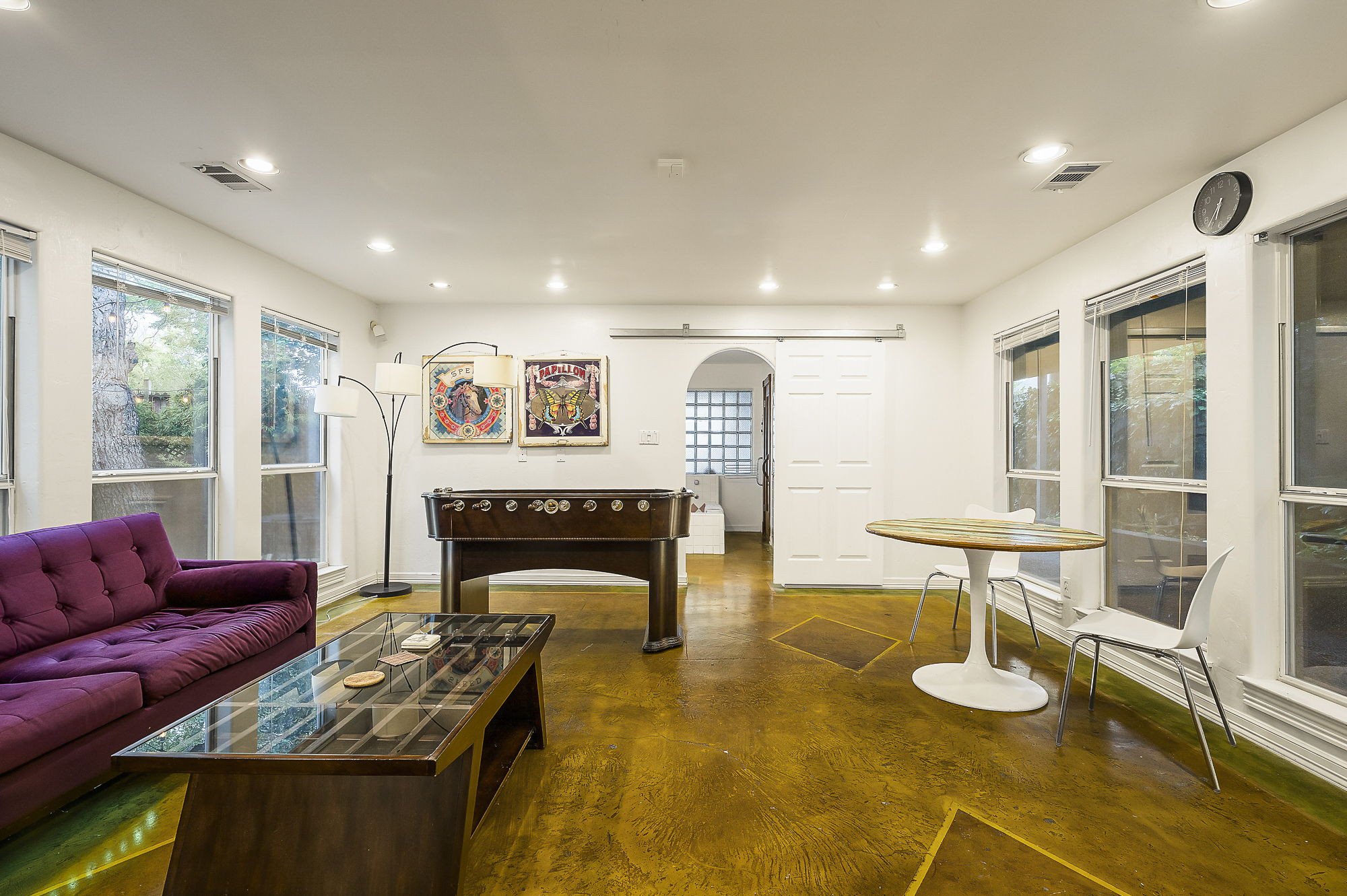 1007 East 8th Street Austin, TX 78702 - Photo 21 of 40 Living area featuring arched walkways, recessed lighting, and healthy amount of natural light