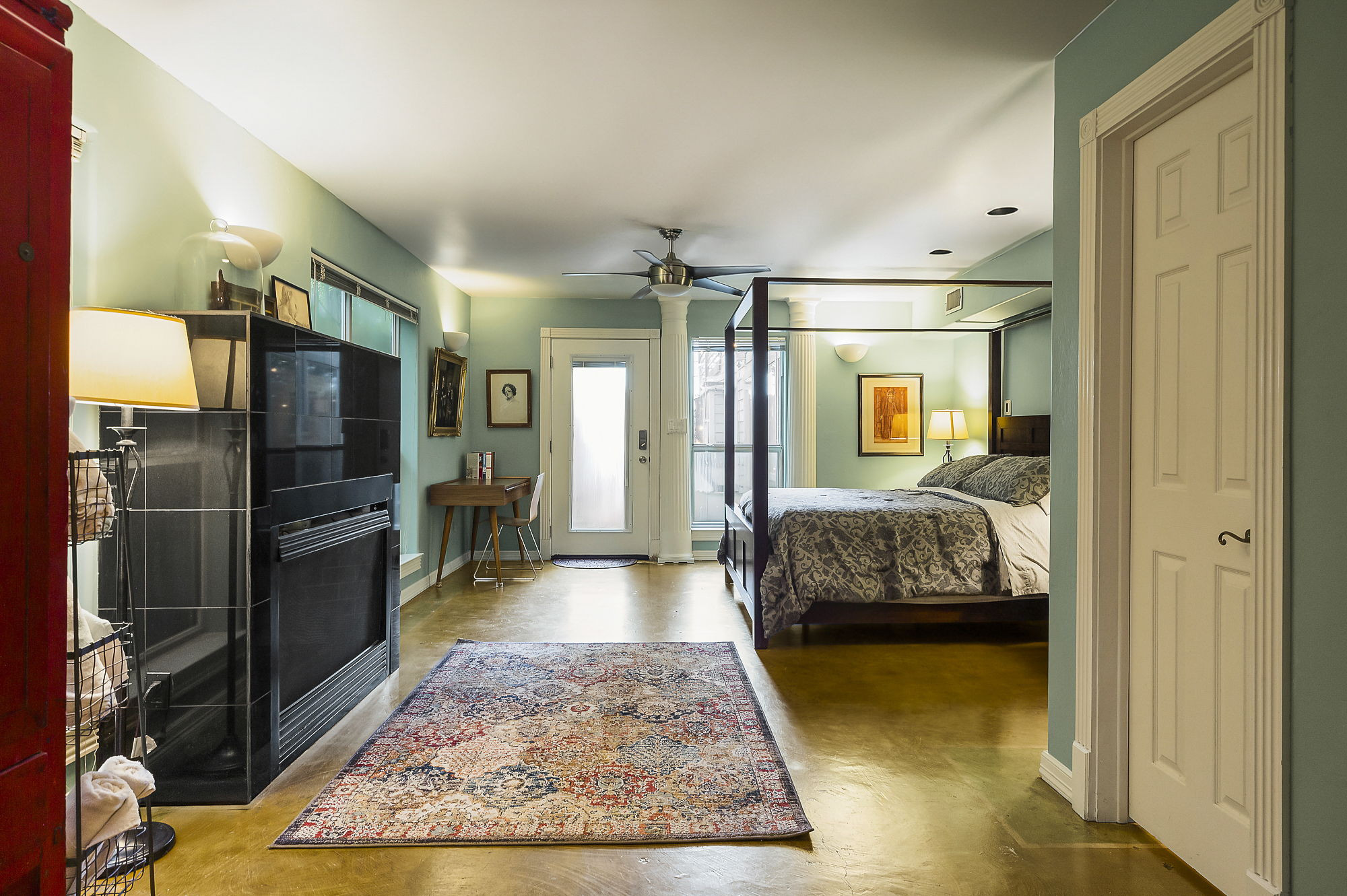 1007 East 8th Street Austin, TX 78702 - Photo 29 of 40 Bedroom with concrete floors, access to outside, and ceiling fan