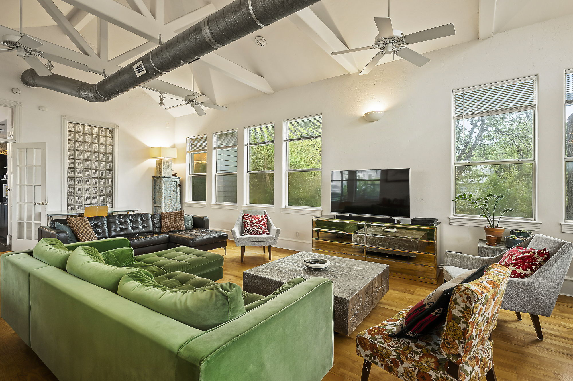 1007 East 8th Street Austin, TX 78702 - Photo 8 of 40 Living area featuring a ceiling fan, wood finished floors, and vaulted ceiling
