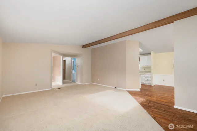 a view of a kitchen with wooden floor and a kitchen