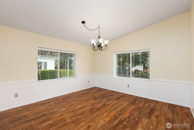 a kitchen with a sink a stove and cabinets