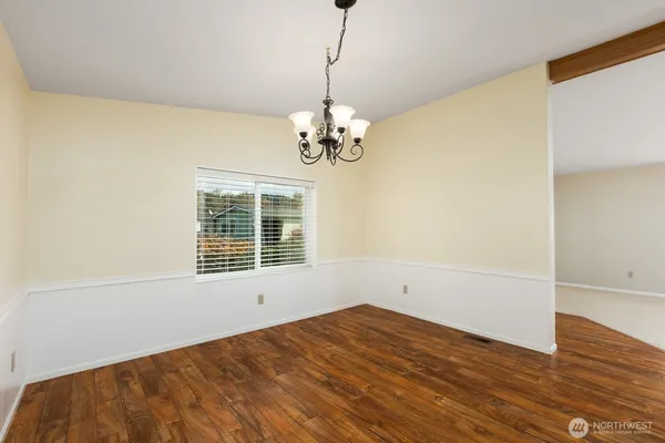 a kitchen with granite countertop wooden cabinets stove top oven and sink